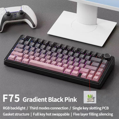 Gradient black pink keyboard on a desk with gaming accessories